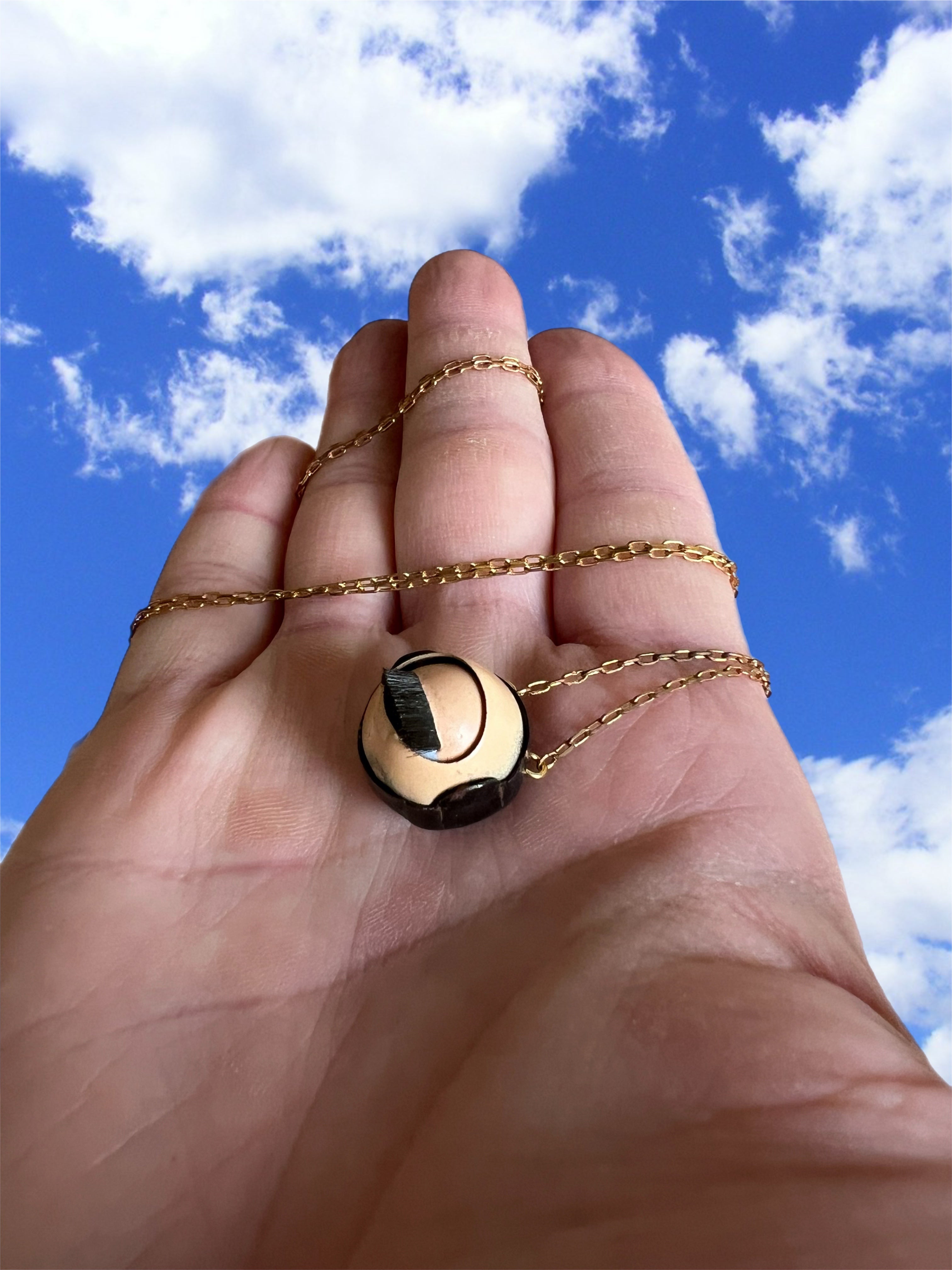 Small vintage doll eye necklace