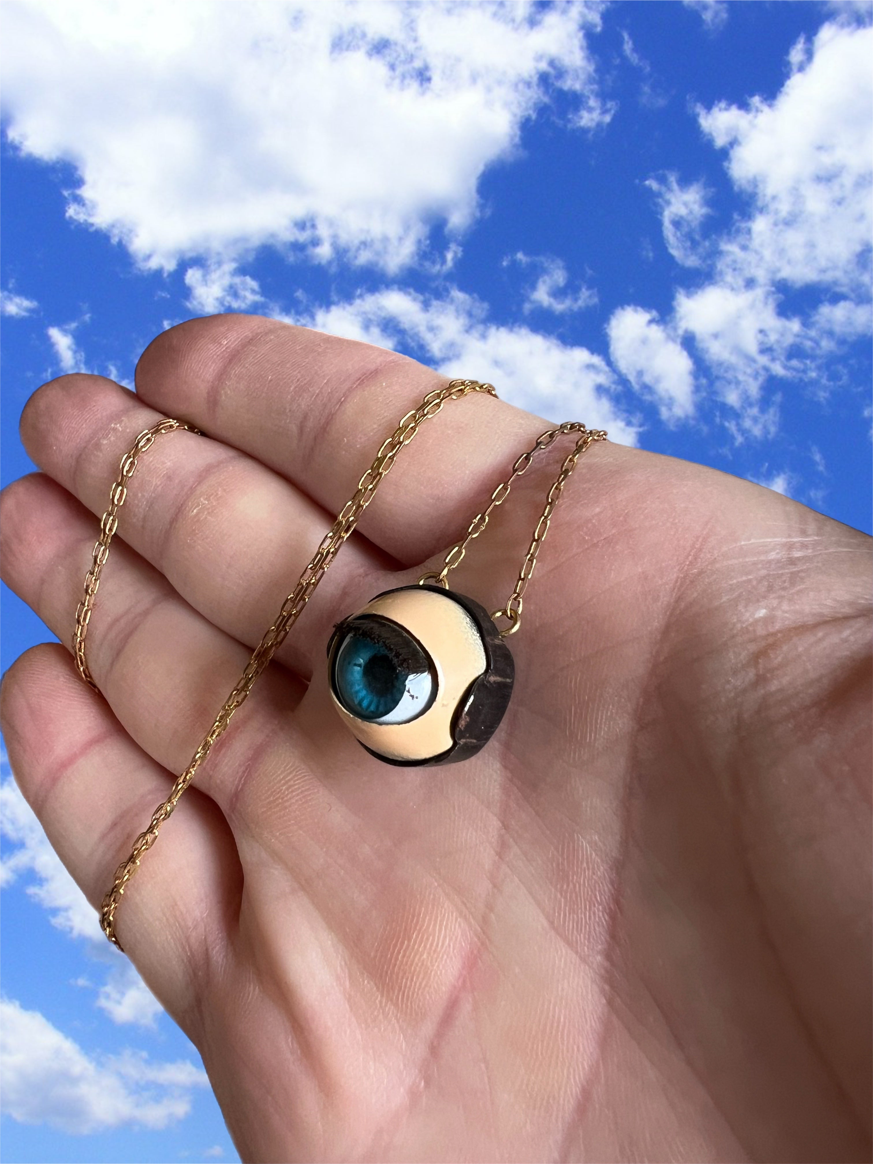 Small vintage doll eye necklace